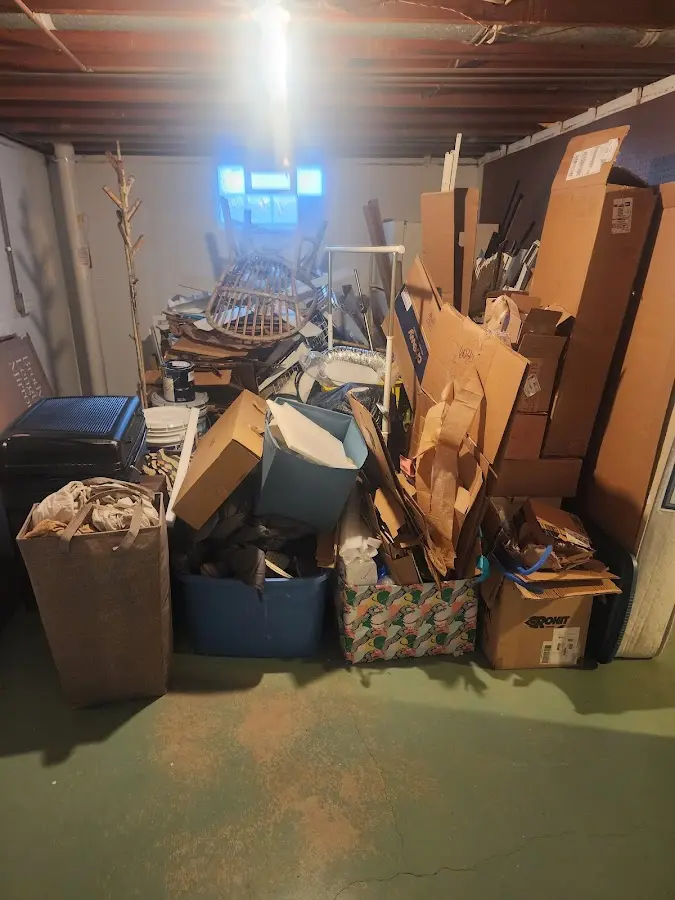 Roll-off dumpster container at job site for 2 Yard Dumpster Rental in Raymore